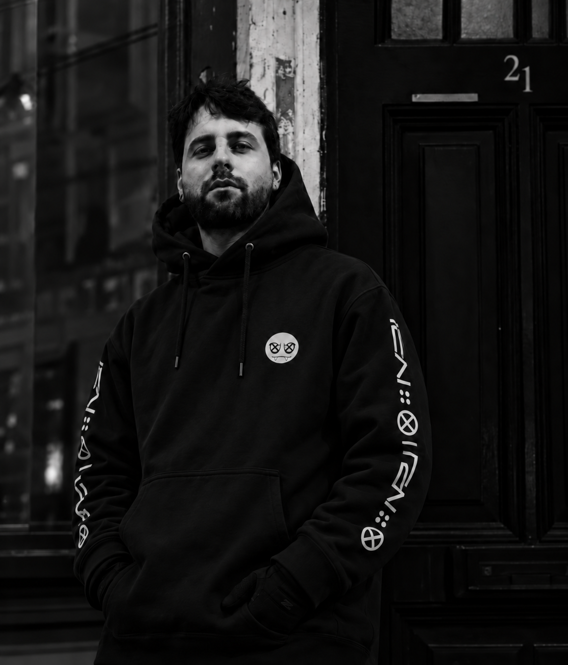 AGOSTO standing outside an Amsterdam doorway